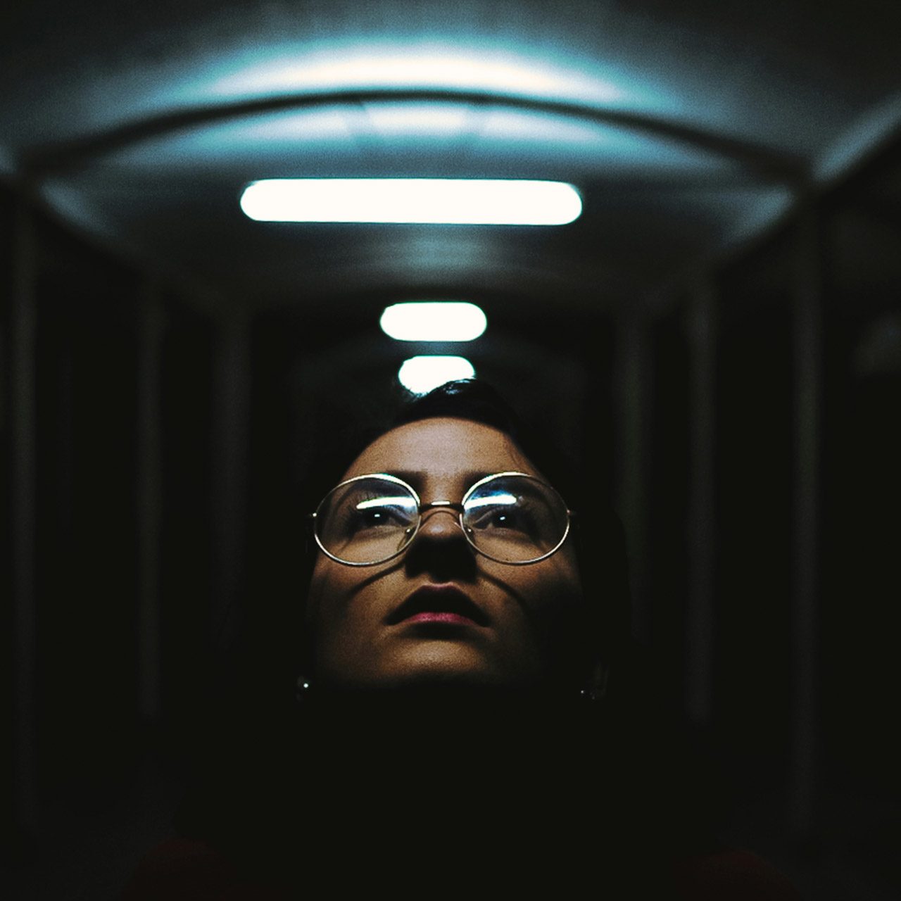 Portrait under corridor lights before FilmGrainLab, clean digital image